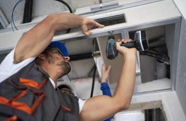 low-angle-people-working-with-drill